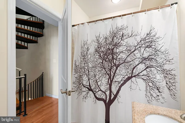 a view of a porch with wooden floor and bench