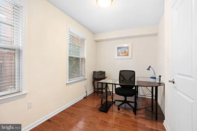 a workspace with furniture and a window