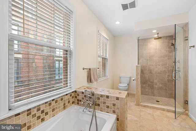 a bathroom with a shower and a sink