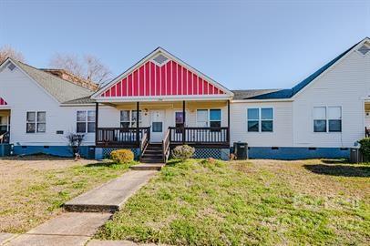 308 South Hoskins Road, Unit D Charlotte, NC 28208 - Photo 19 of 19 a view of a house with swimming pool and porch