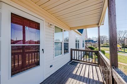 308 South Hoskins Road, Unit D Charlotte, NC 28208 - Photo 2 of 19 a view of a balcony with wooden floor