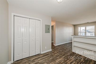 308 South Hoskins Road, Unit D Charlotte, NC 28208 - Photo 6 of 19 a view of an empty room with wooden floor and a window