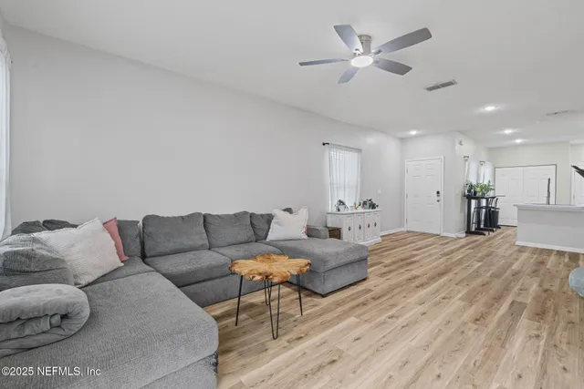 a view of a room with wooden floor
