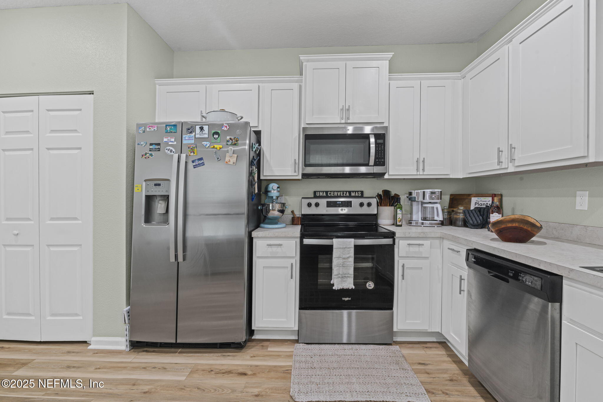 852 Capitol Parkway Jacksonville, FL 32218 - Photo 14 of 42 a kitchen with stainless steel appliances granite countertop a refrigerator a stove top oven a sink and dishwasher