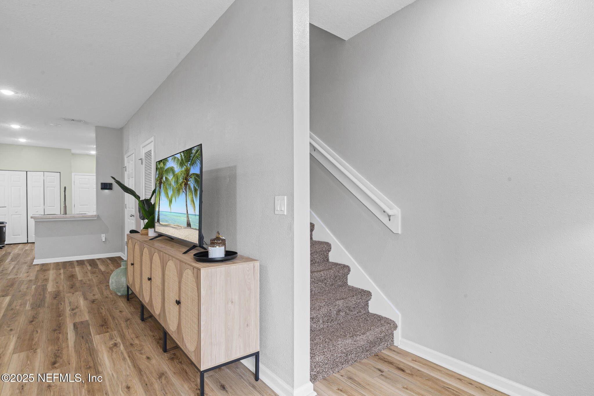 852 Capitol Parkway Jacksonville, FL 32218 - Photo 18 of 42 a view of a hallway with wooden floor and staircase