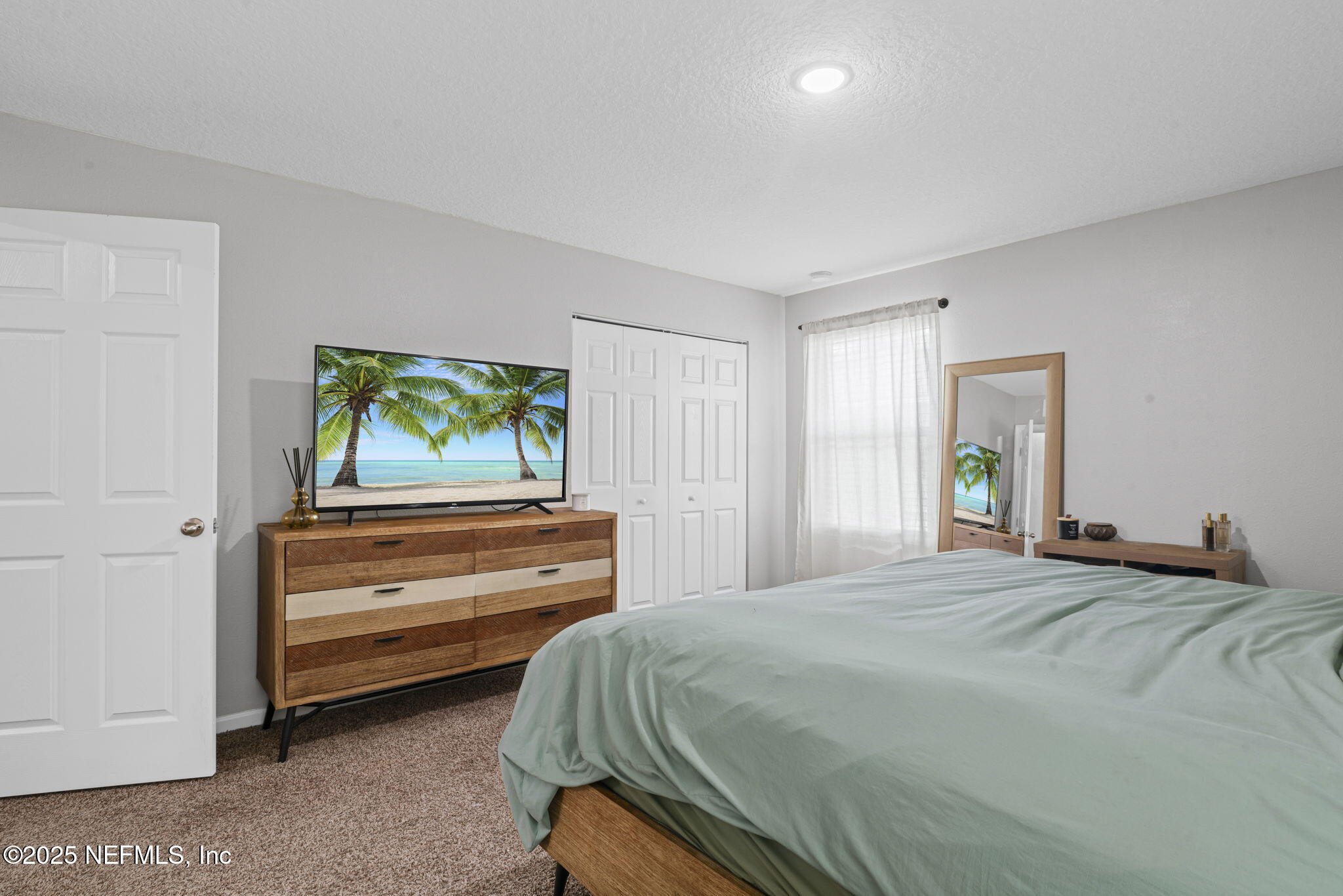 852 Capitol Parkway Jacksonville, FL 32218 - Photo 22 of 42 a bedroom with a bed and a window