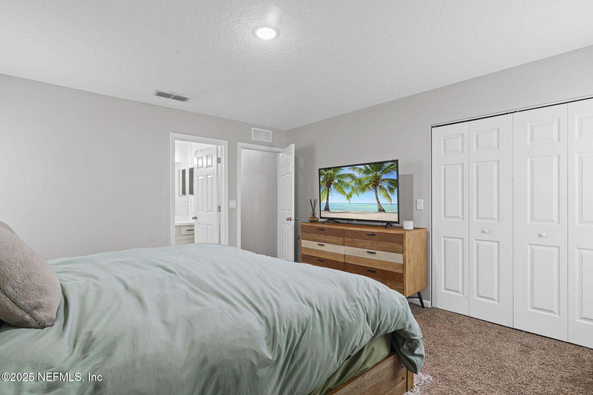 852 Capitol Parkway Jacksonville, FL 32218 - Photo 23 of 42 a bedroom with a bed and a window