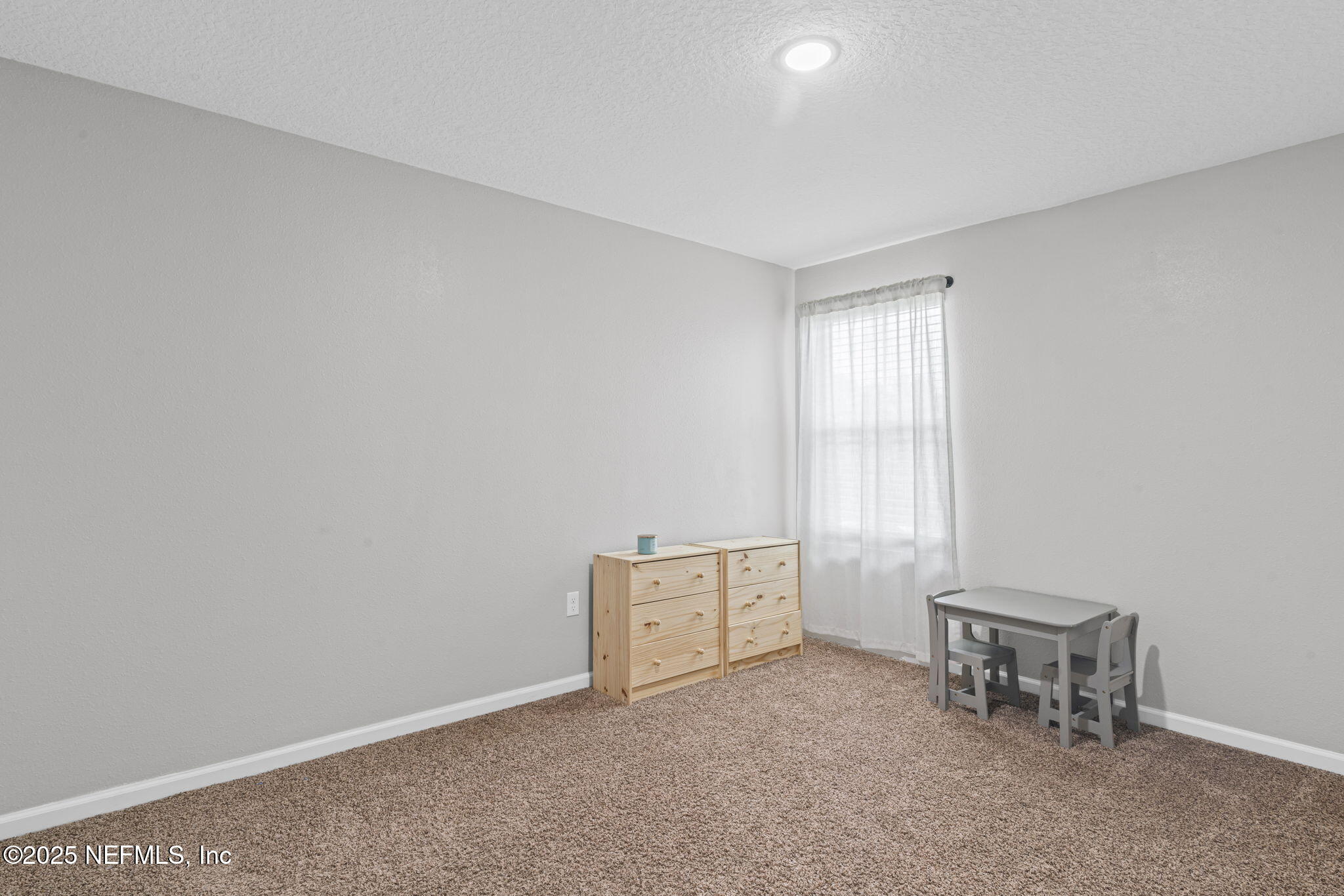 852 Capitol Parkway Jacksonville, FL 32218 - Photo 24 of 42 a view of an empty room with a window