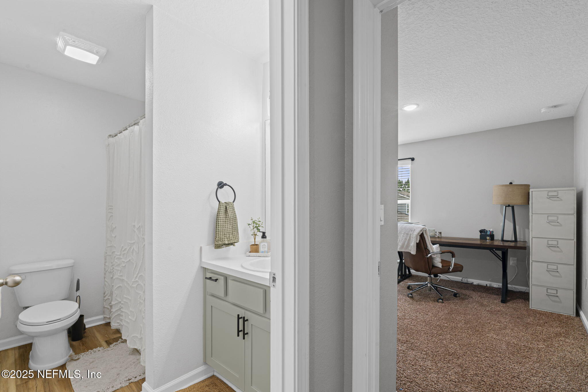 852 Capitol Parkway Jacksonville, FL 32218 - Photo 26 of 42 a bathroom with a sink toilet and a tub