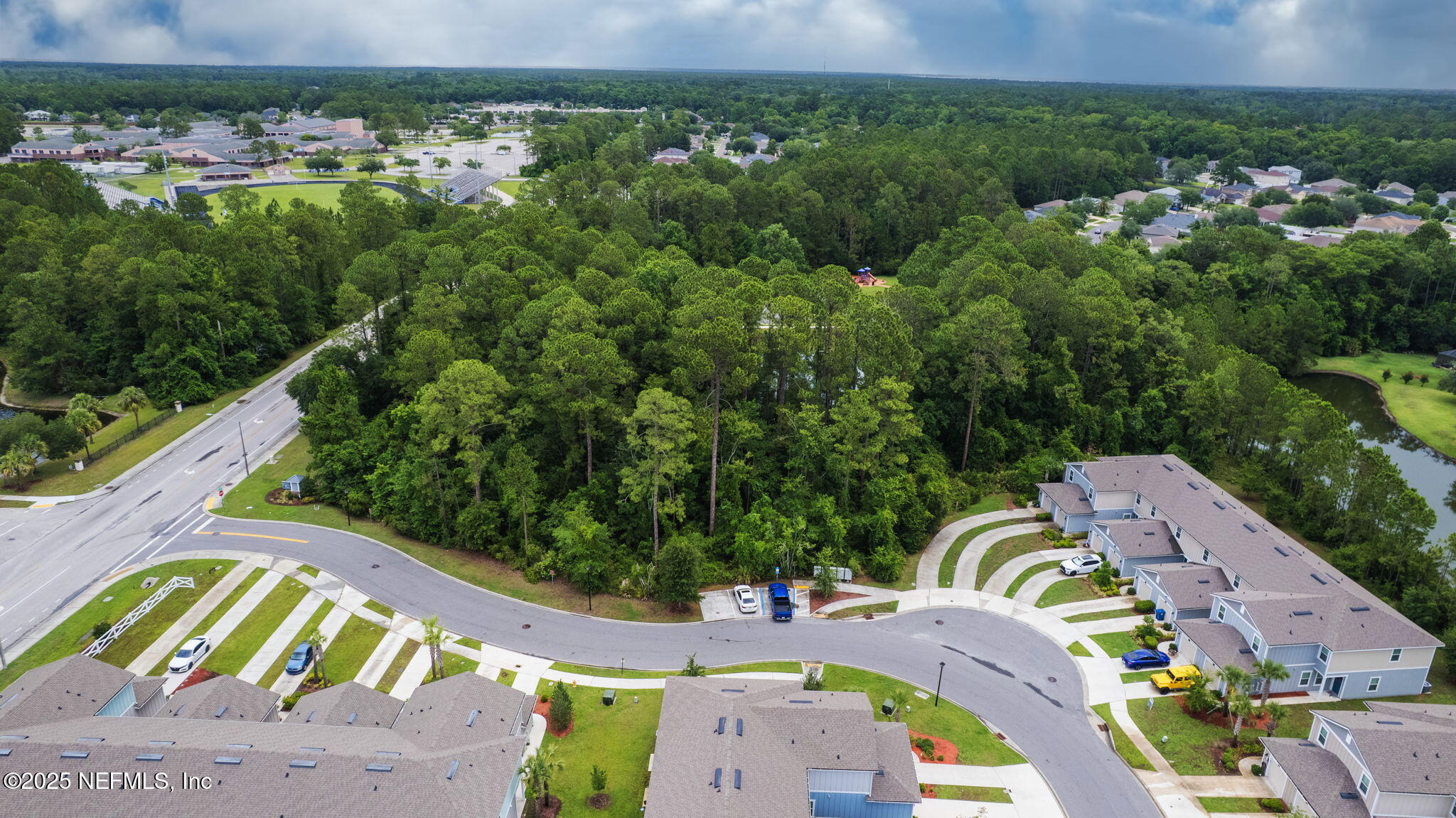 852 Capitol Parkway Jacksonville, FL 32218 - Photo 39 of 42 an aerial view of a swimming pool patio and mountain view
