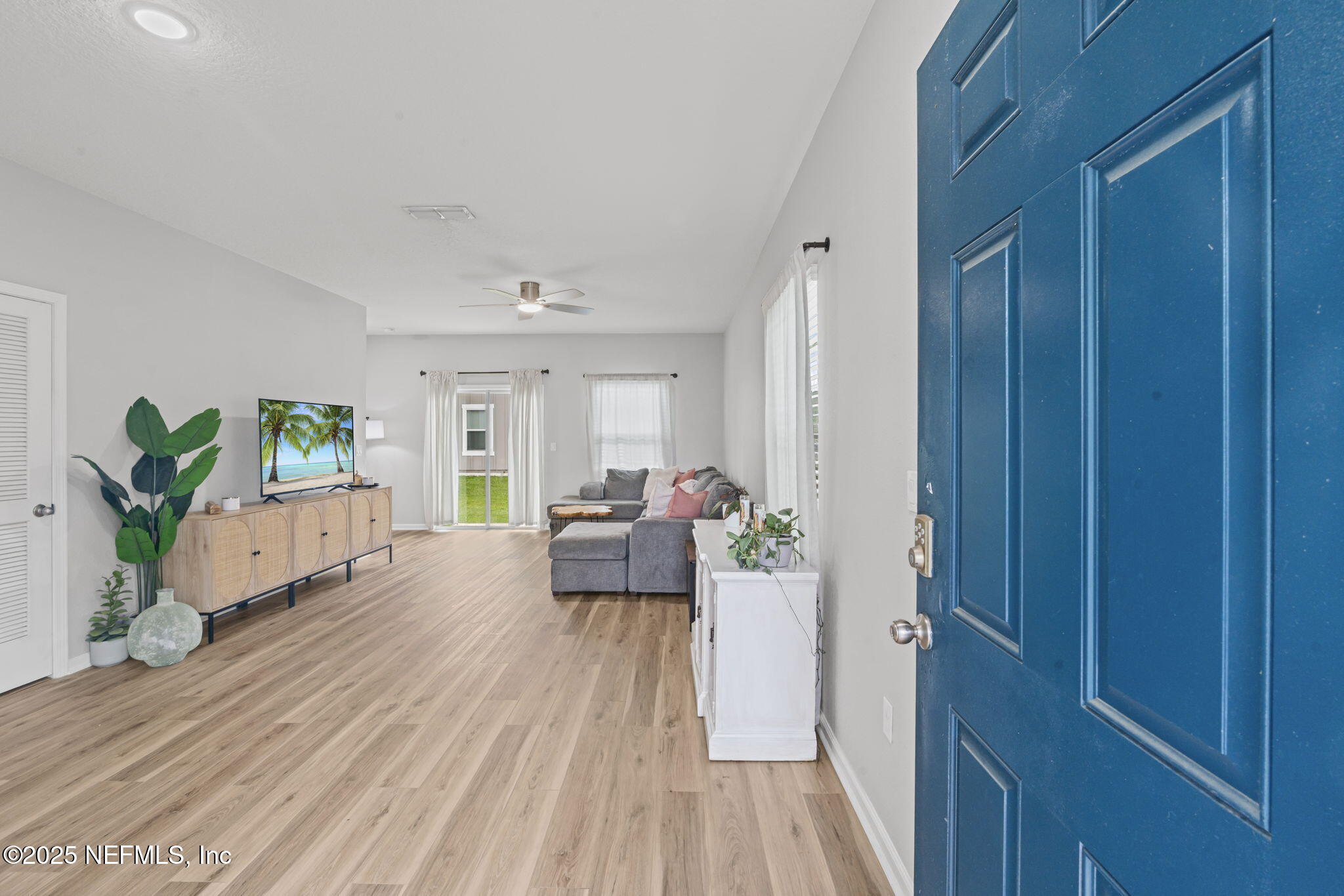 852 Capitol Parkway Jacksonville, FL 32218 - Photo 6 of 42 a living room with furniture and a wooden floor