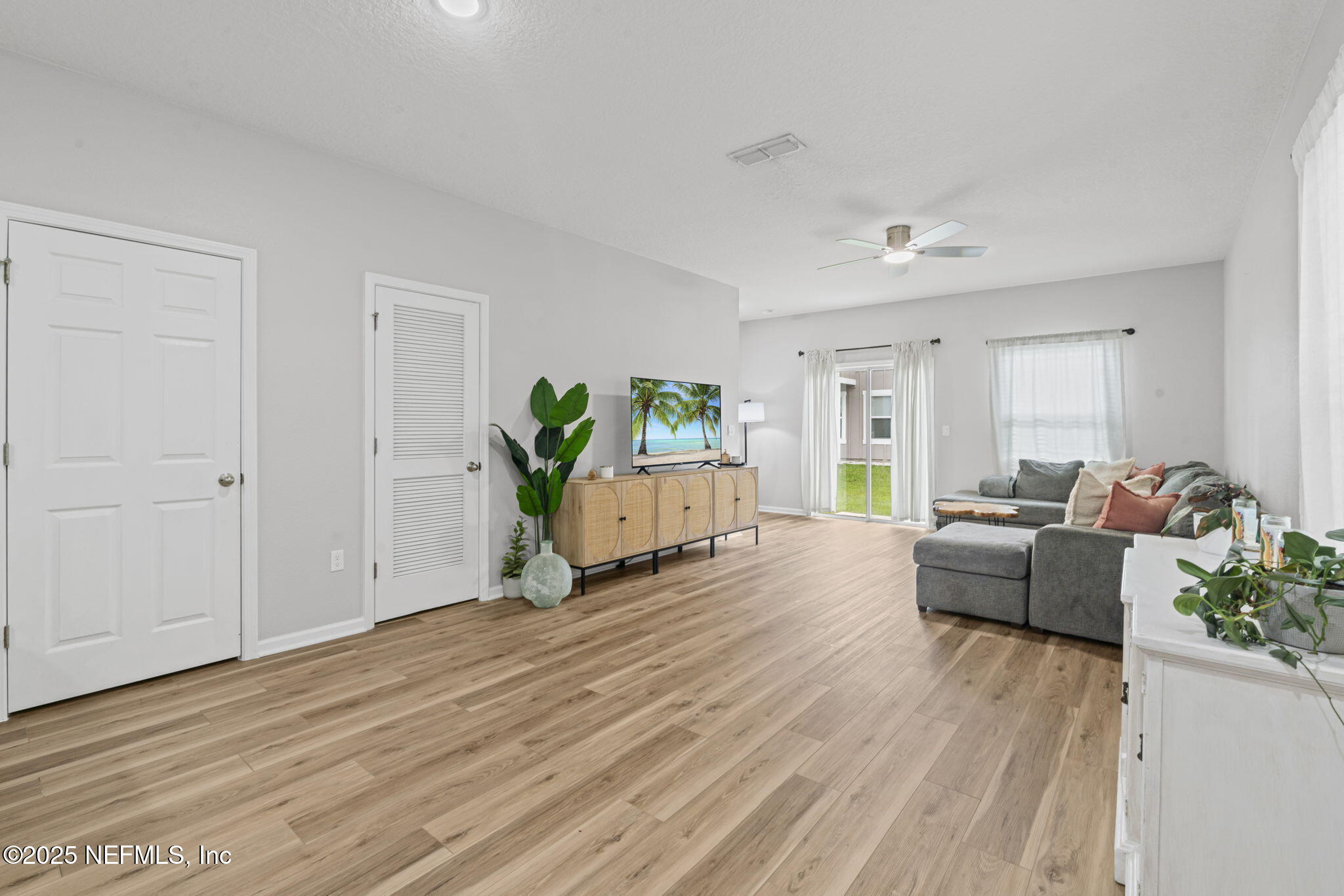 852 Capitol Parkway Jacksonville, FL 32218 - Photo 7 of 42 a living room with furniture and wooden floor