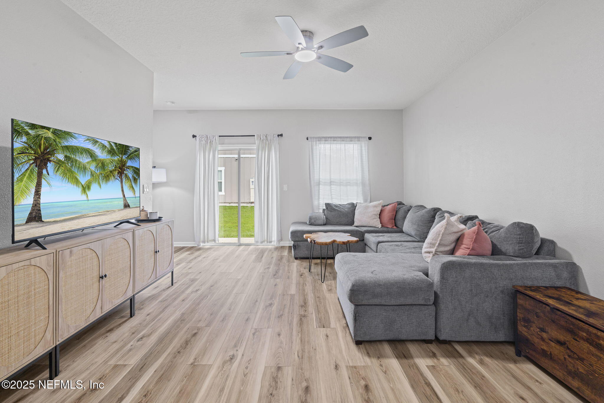 852 Capitol Parkway Jacksonville, FL 32218 - Photo 10 of 42 a living room with furniture and a flat screen tv