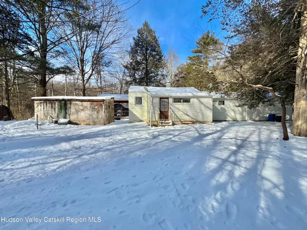 a view of house with trees in the background