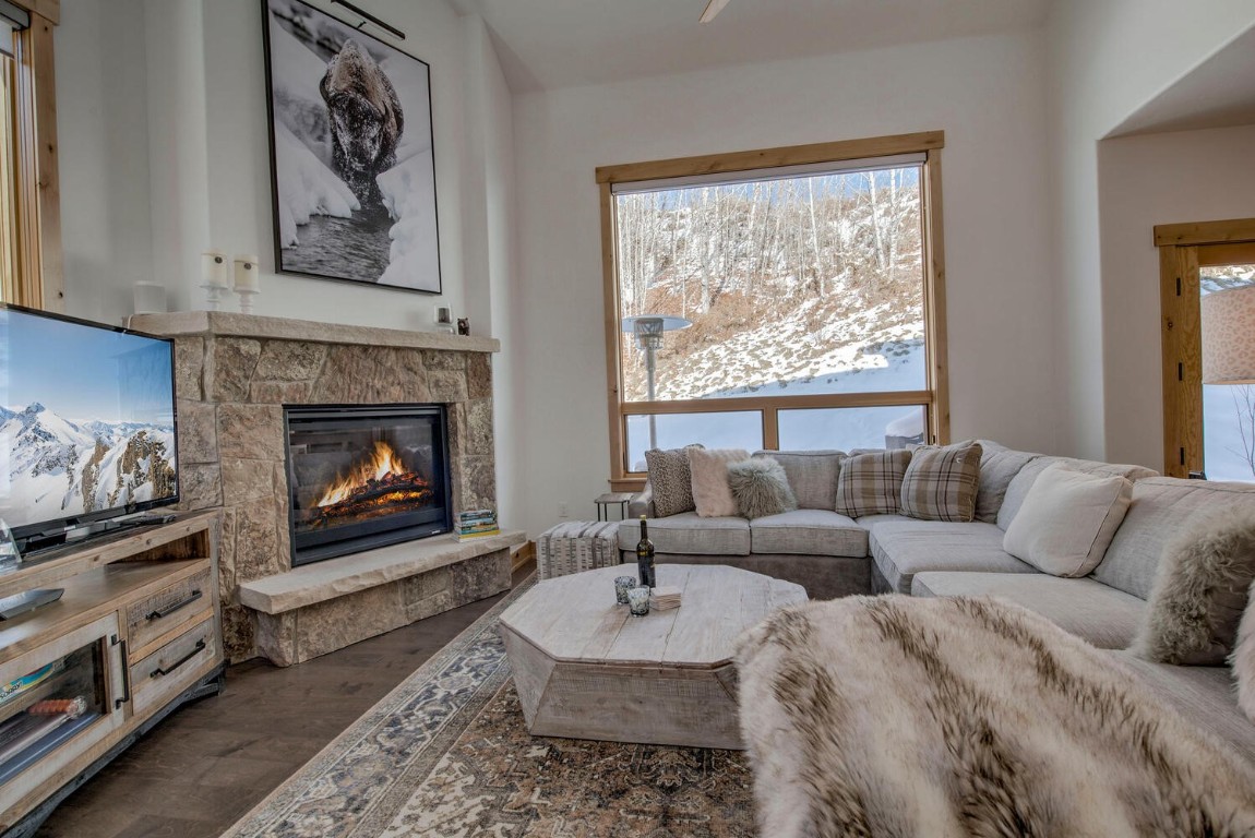 28 Damselfly Loop Silverthorne, CO 80498 - Photo 14 of 45 a living room with furniture and a fireplace