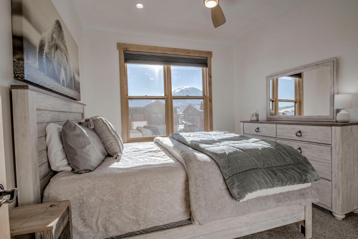 28 Damselfly Loop Silverthorne, CO 80498 - Photo 21 of 45 a bedroom with a bed and window