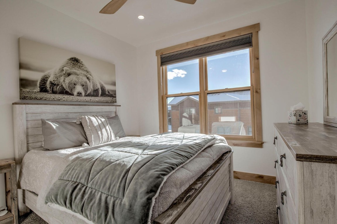 28 Damselfly Loop Silverthorne, CO 80498 - Photo 22 of 45 a bedroom with a bed and a window
