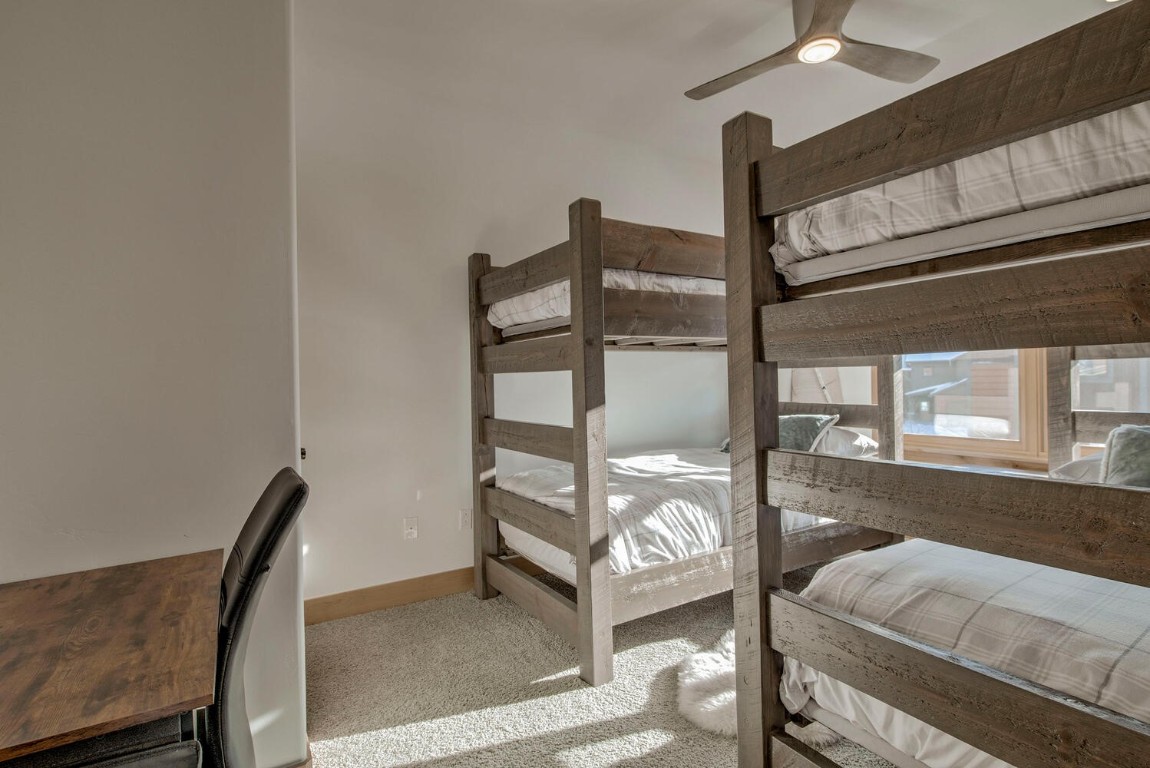 28 Damselfly Loop Silverthorne, CO 80498 - Photo 31 of 45 a bedroom with furniture and a window