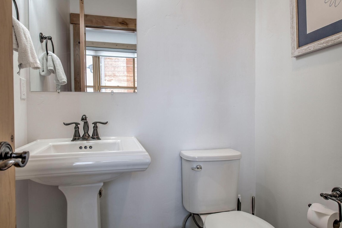 28 Damselfly Loop Silverthorne, CO 80498 - Photo 32 of 45 a bathroom with a sink a toilet and mirror