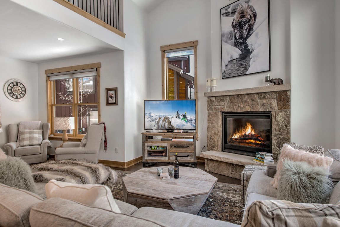 28 Damselfly Loop Silverthorne, CO 80498 - Photo 9 of 45 a living room with furniture and a fireplace
