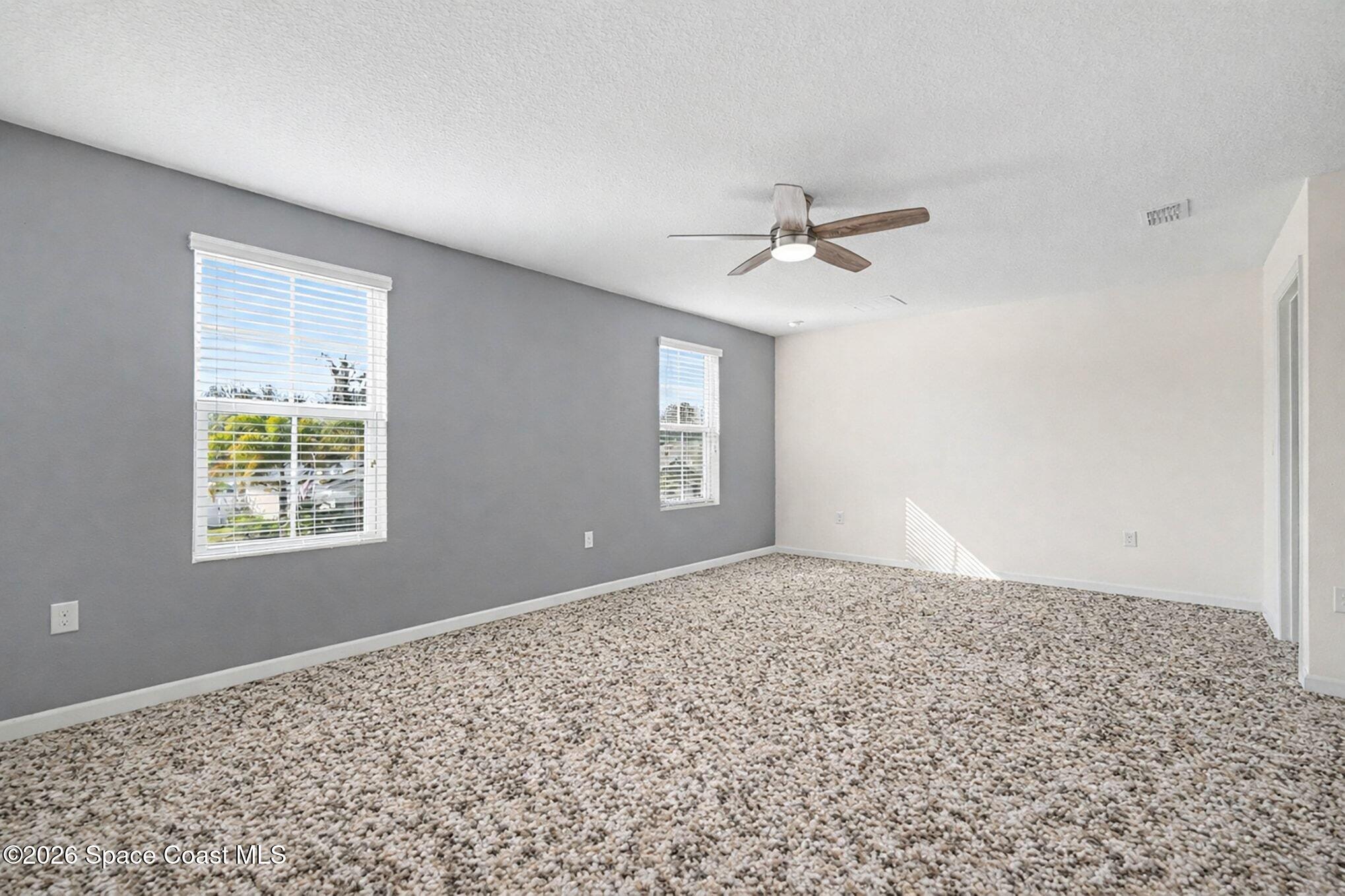 2535 Falcon Lane Mims, FL 32754 - Photo 18 of 31 a view of an empty room with a window