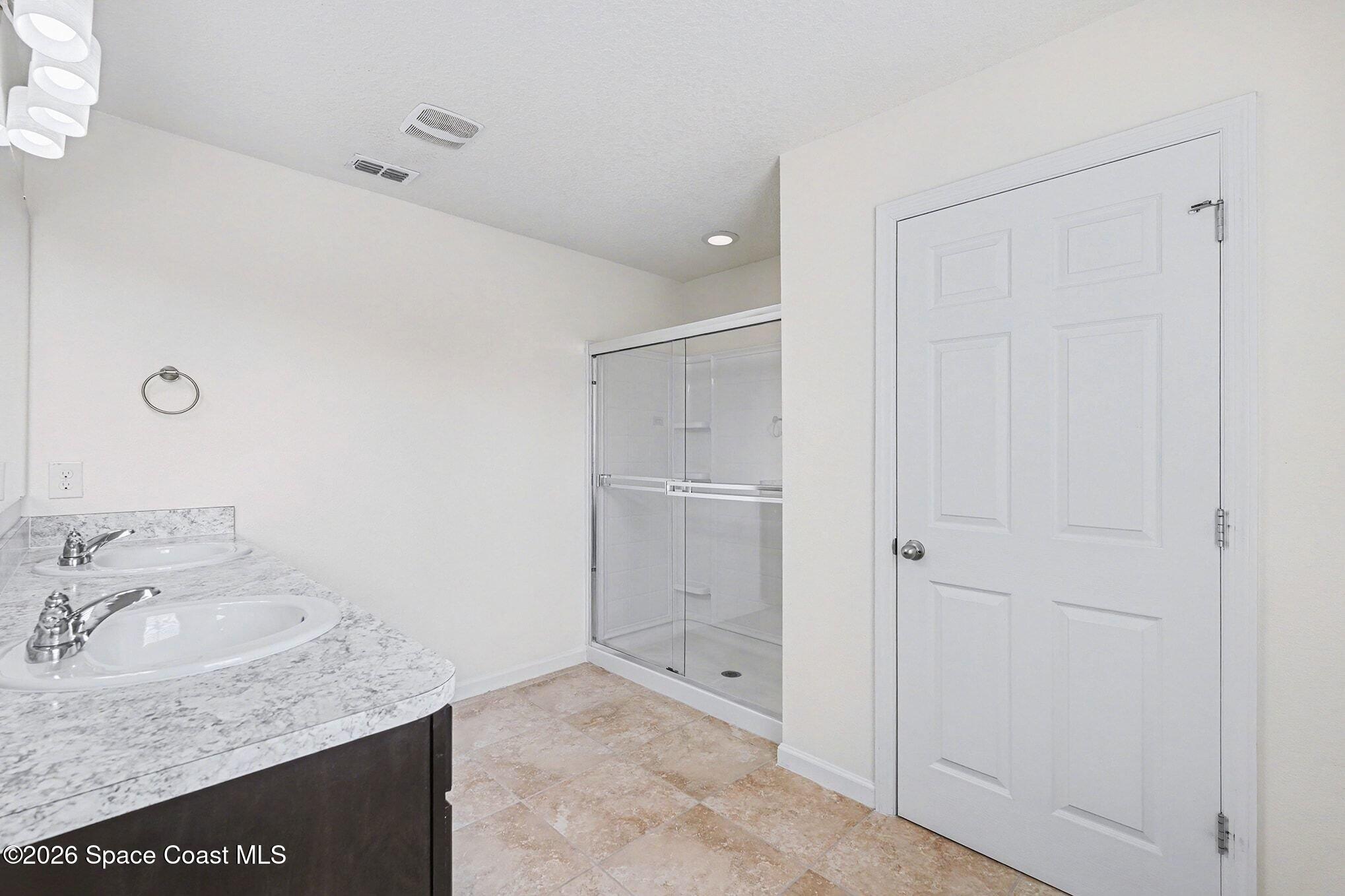 2535 Falcon Lane Mims, FL 32754 - Photo 20 of 31 a bathroom with a granite countertop sink and a mirror