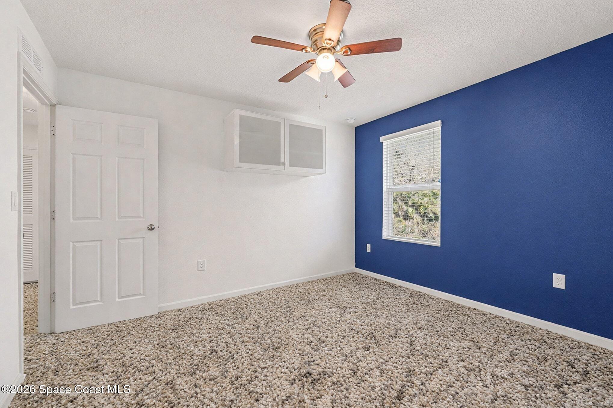 2535 Falcon Lane Mims, FL 32754 - Photo 24 of 31 a view of an empty room with a window