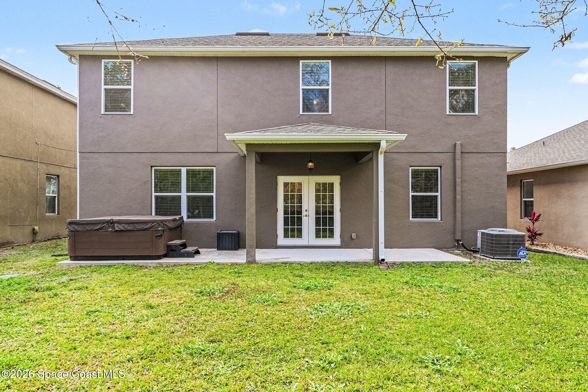2535 Falcon Lane Mims, FL 32754 - Photo 27 of 31 a front view of a house with a yard and a table