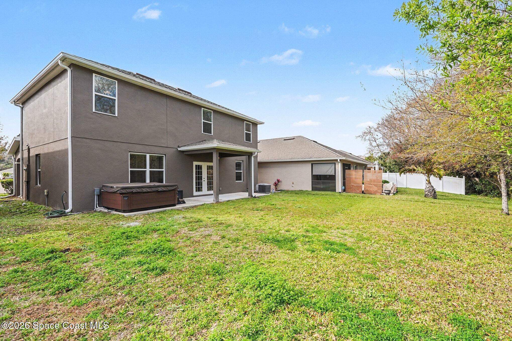 2535 Falcon Lane Mims, FL 32754 - Photo 28 of 31 a front view of house with yard and green space