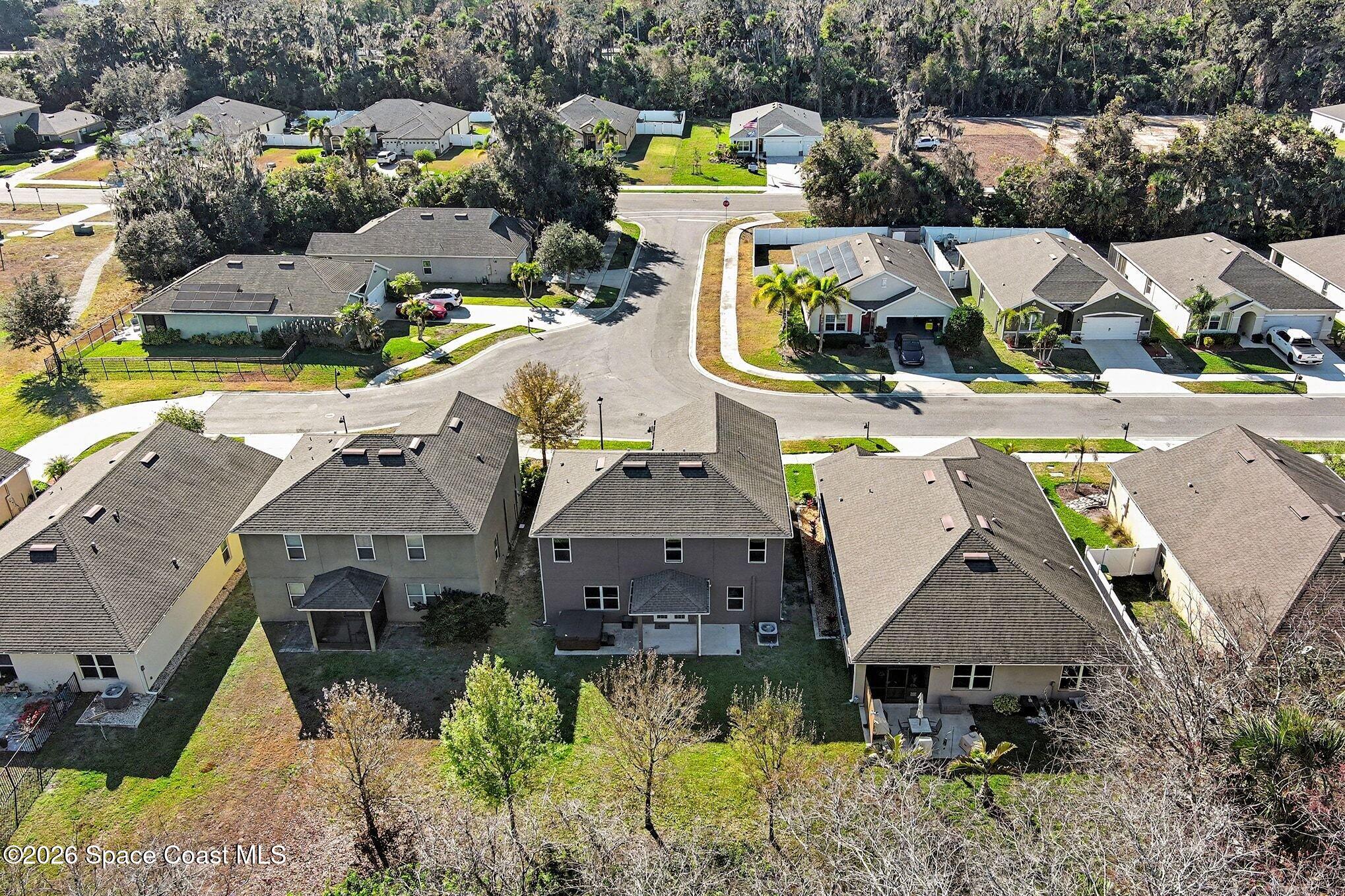2535 Falcon Lane Mims, FL 32754 - Photo 29 of 31 an aerial view of a house with swimming pool and ocean view