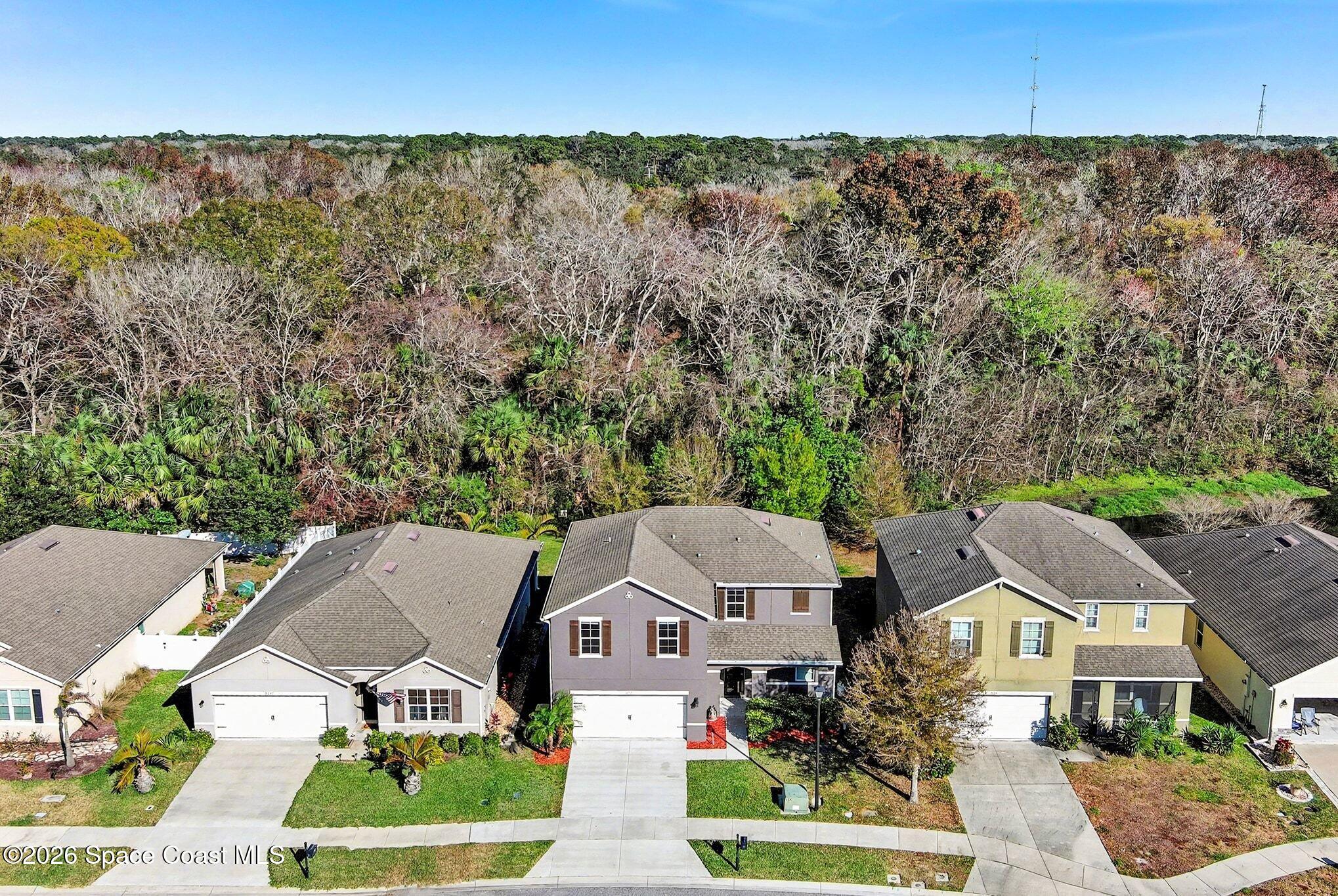 2535 Falcon Lane Mims, FL 32754 - Photo 5 of 31 an aerial view of residential houses with outdoor space and trees