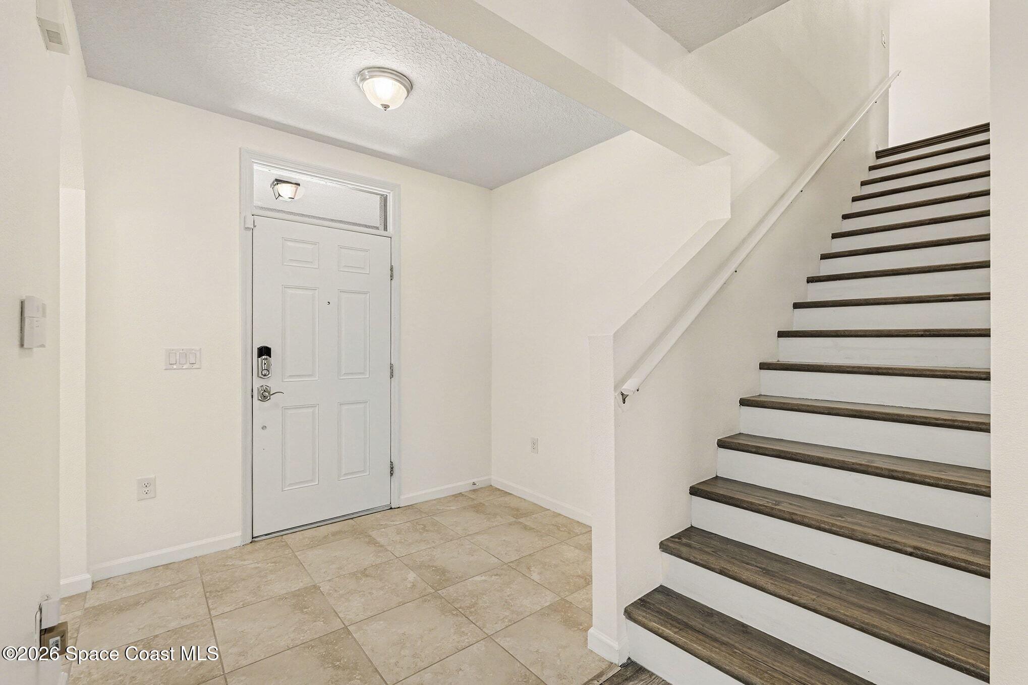 2535 Falcon Lane Mims, FL 32754 - Photo 6 of 31 a view of entryway with wooden floor