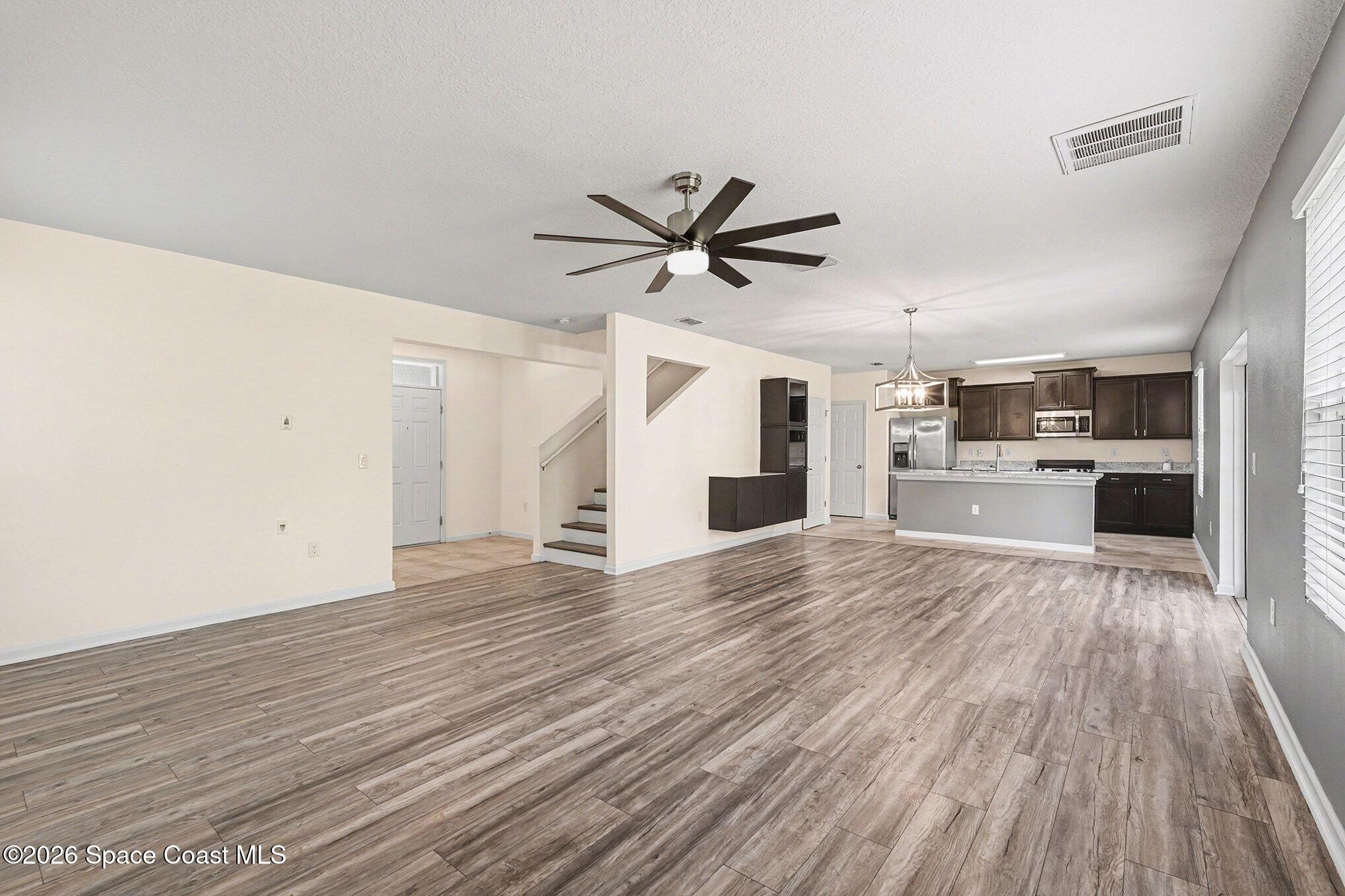 2535 Falcon Lane Mims, FL 32754 - Photo 9 of 31 a view of a kitchen with a sink and a stove top oven