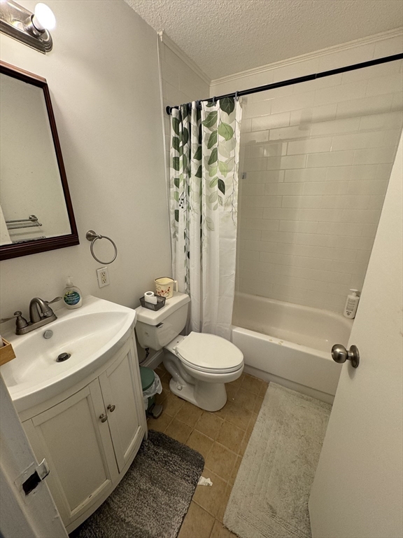 44 Washington Street, Unit 208 Brookline, MA 02445 - Photo 4 of 13 a bathroom with a sink toilet and shower