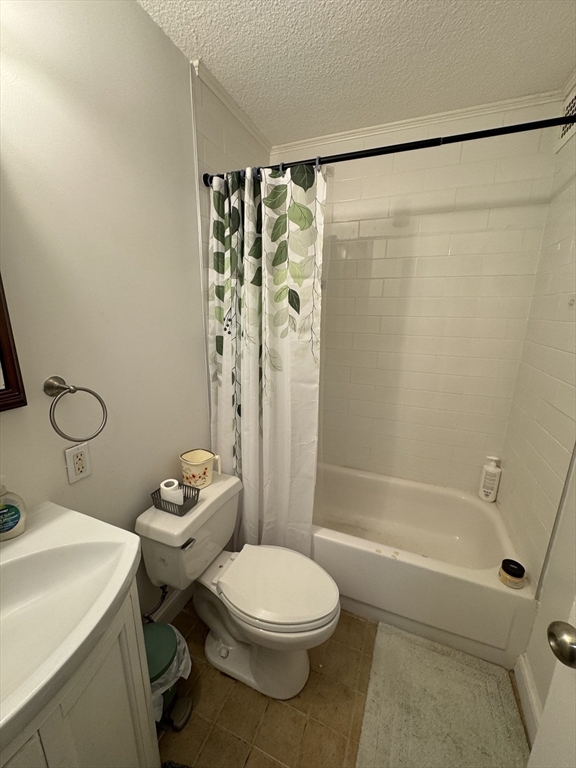44 Washington Street, Unit 208 Brookline, MA 02445 - Photo 7 of 13 a bathroom with a toilet a sink and a shower