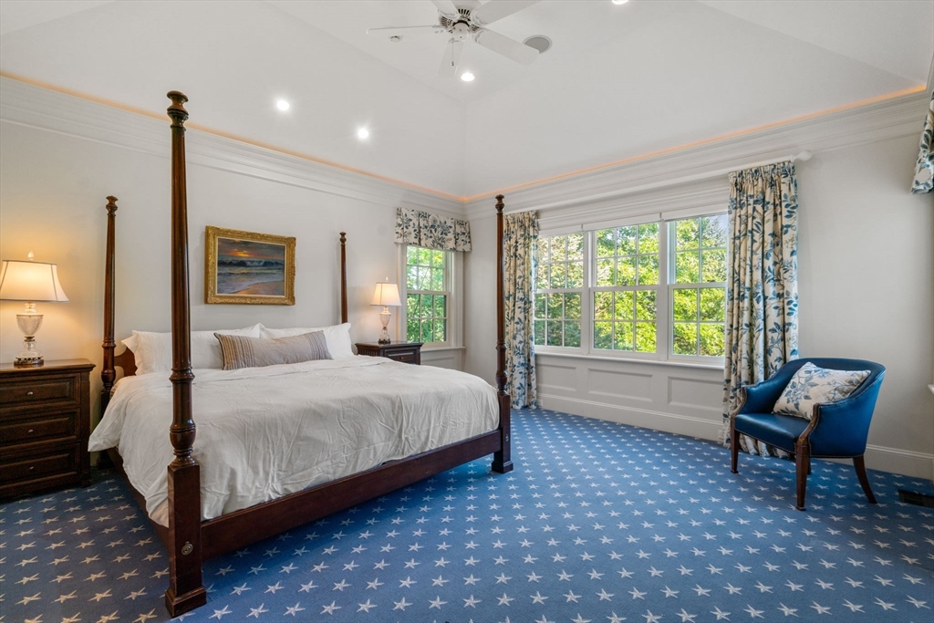 27 Pine Summit Circle, Unit 27 Weston, MA 02493 - Photo 19 of 42 a bedroom with a bed chair and window