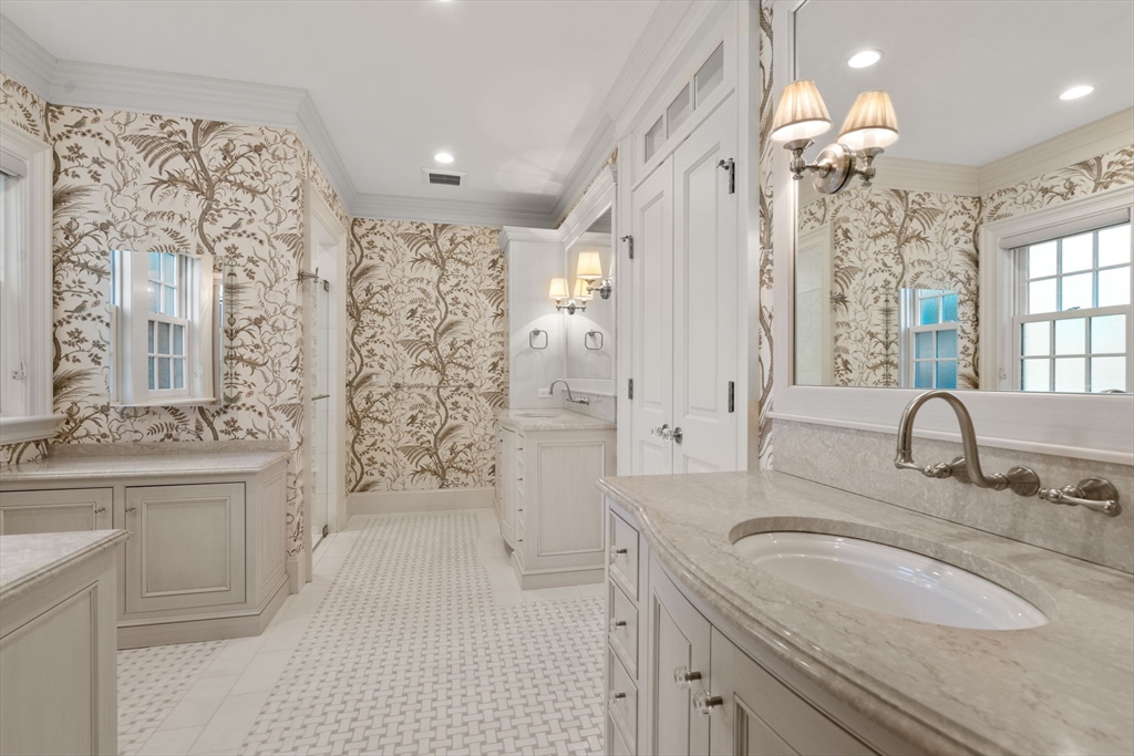 27 Pine Summit Circle, Unit 27 Weston, MA 02493 - Photo 20 of 42 a bathroom with double vanity sink a two mirror a bathtub and shower
