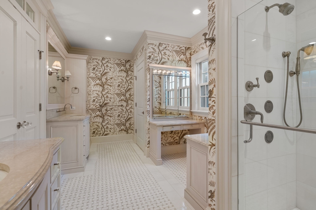 27 Pine Summit Circle, Unit 27 Weston, MA 02493 - Photo 21 of 42 a bathroom with a shower sink and mirror