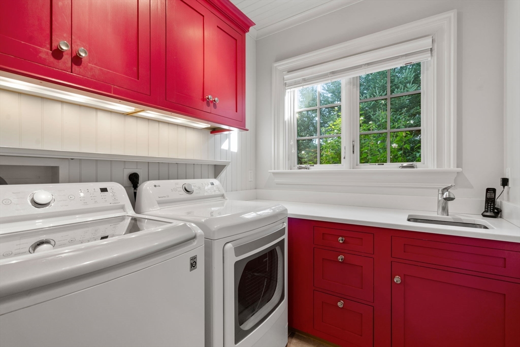 27 Pine Summit Circle, Unit 27 Weston, MA 02493 - Photo 22 of 42 a utility room with sink dryer and washer