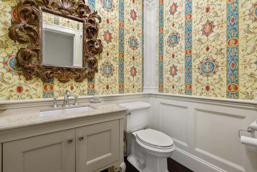 27 Pine Summit Circle, Unit 27 Weston, MA 02493 - Photo 23 of 42 a bathroom with a toilet sink and mirror