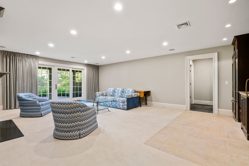 27 Pine Summit Circle, Unit 27 Weston, MA 02493 - Photo 33 of 42 a bedroom with furniture and a large window