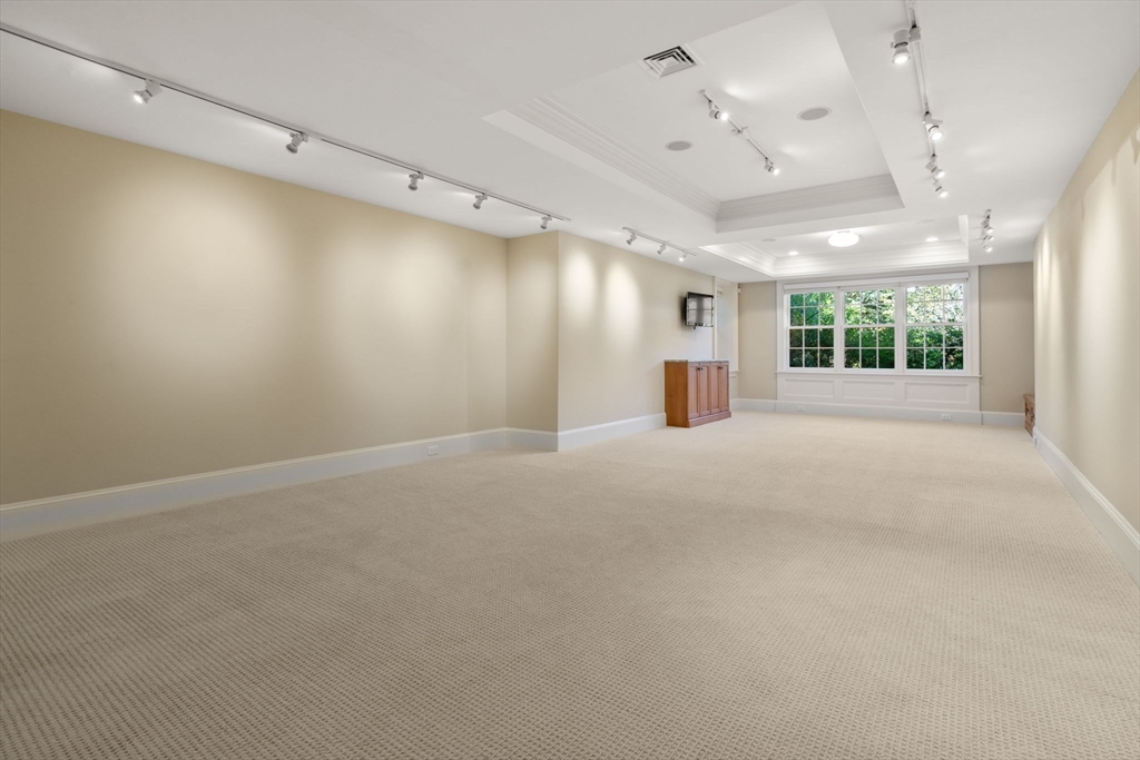 27 Pine Summit Circle, Unit 27 Weston, MA 02493 - Photo 35 of 42 an empty room with windows
