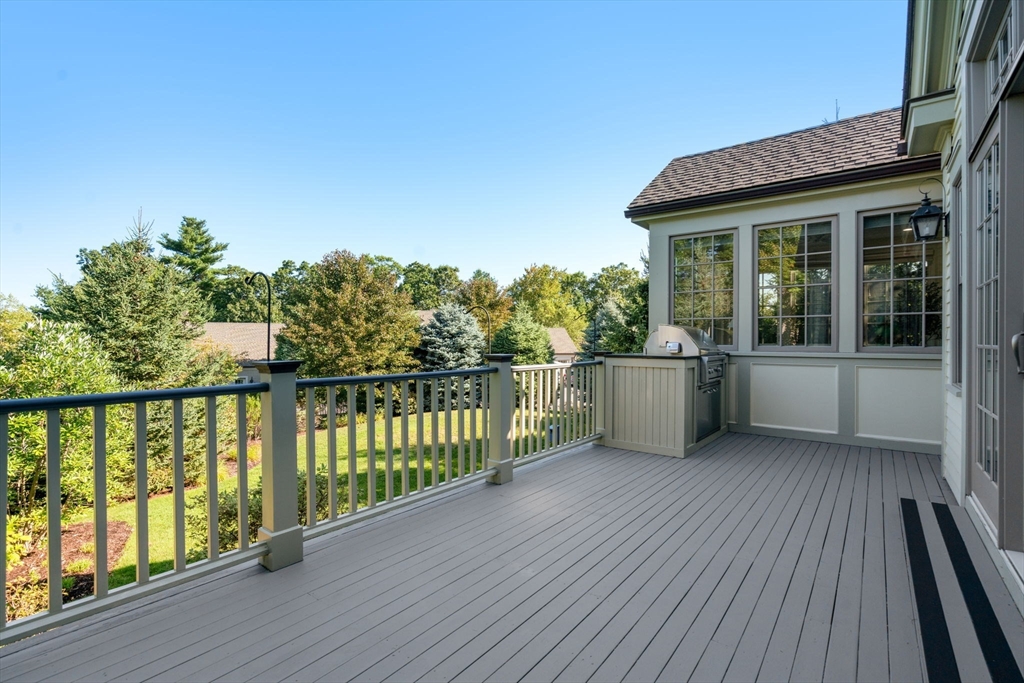 27 Pine Summit Circle, Unit 27 Weston, MA 02493 - Photo 39 of 42 a view of a balcony with wooden floor