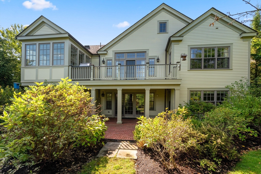 27 Pine Summit Circle, Unit 27 Weston, MA 02493 - Photo 40 of 42 front view of a house with a yard