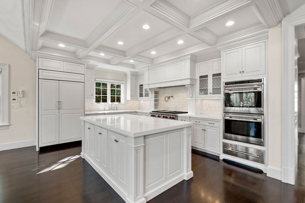 27 Pine Summit Circle, Unit 27 Weston, MA 02493 - Photo 5 of 42 a kitchen with stainless steel appliances granite countertop a stove and a refrigerator