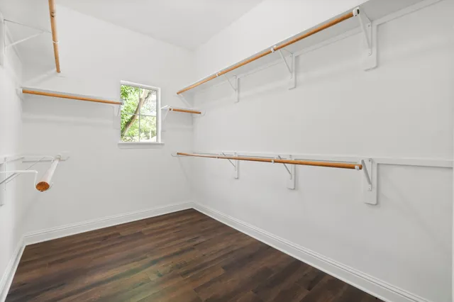 a bathroom with a sink a mirror and a shower