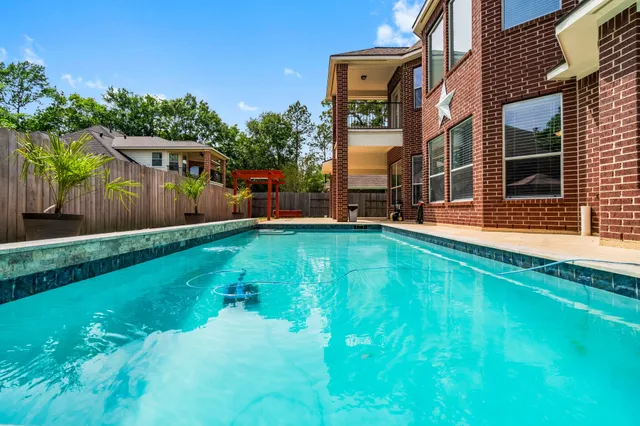 a view of a backyard with sitting area and furniture
