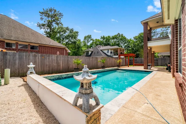a view of a backyard with a small pool