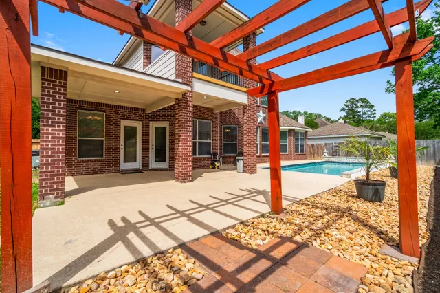 a balcony with view of swimming pool