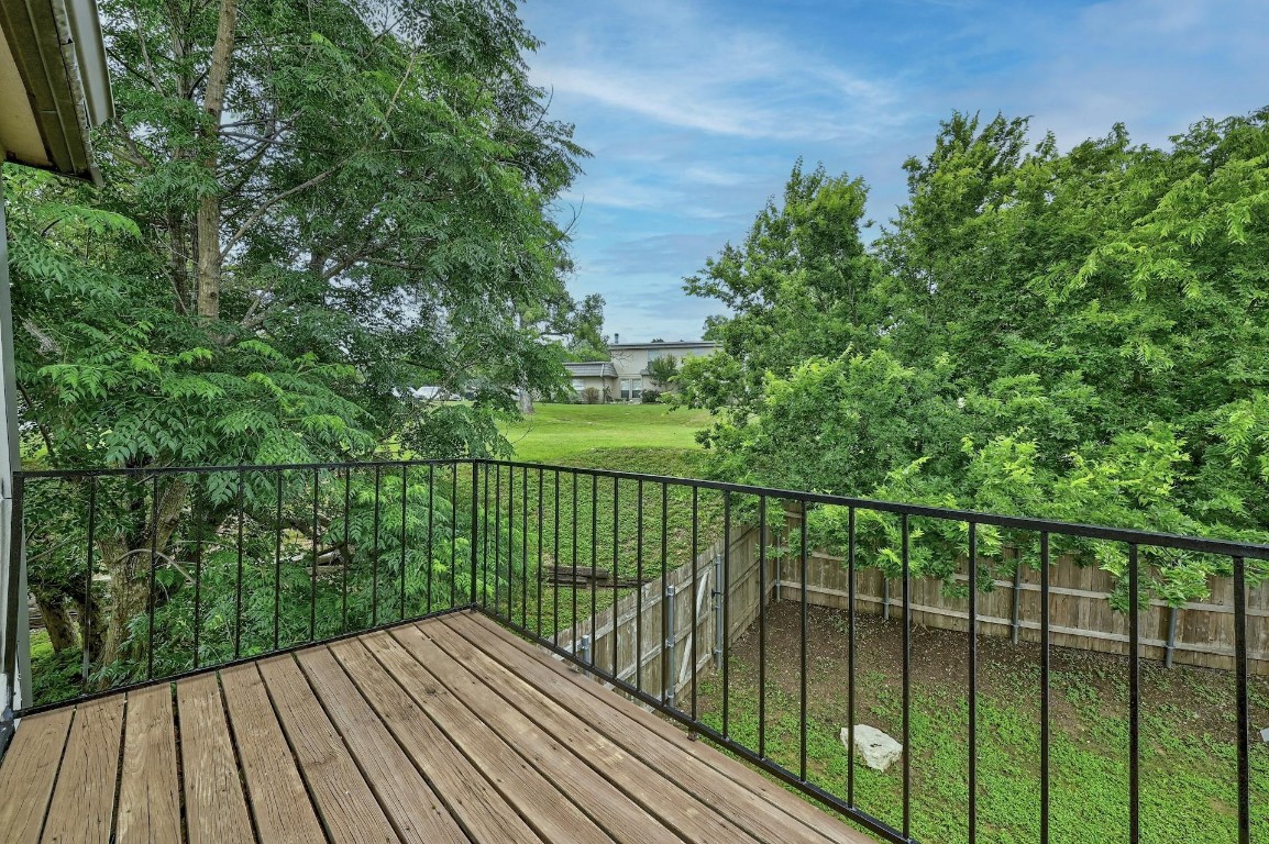 702 Castle Ridge Road, Unit B Austin, TX 78746 - Photo 2 of 23 a view of balcony with wooden floor
